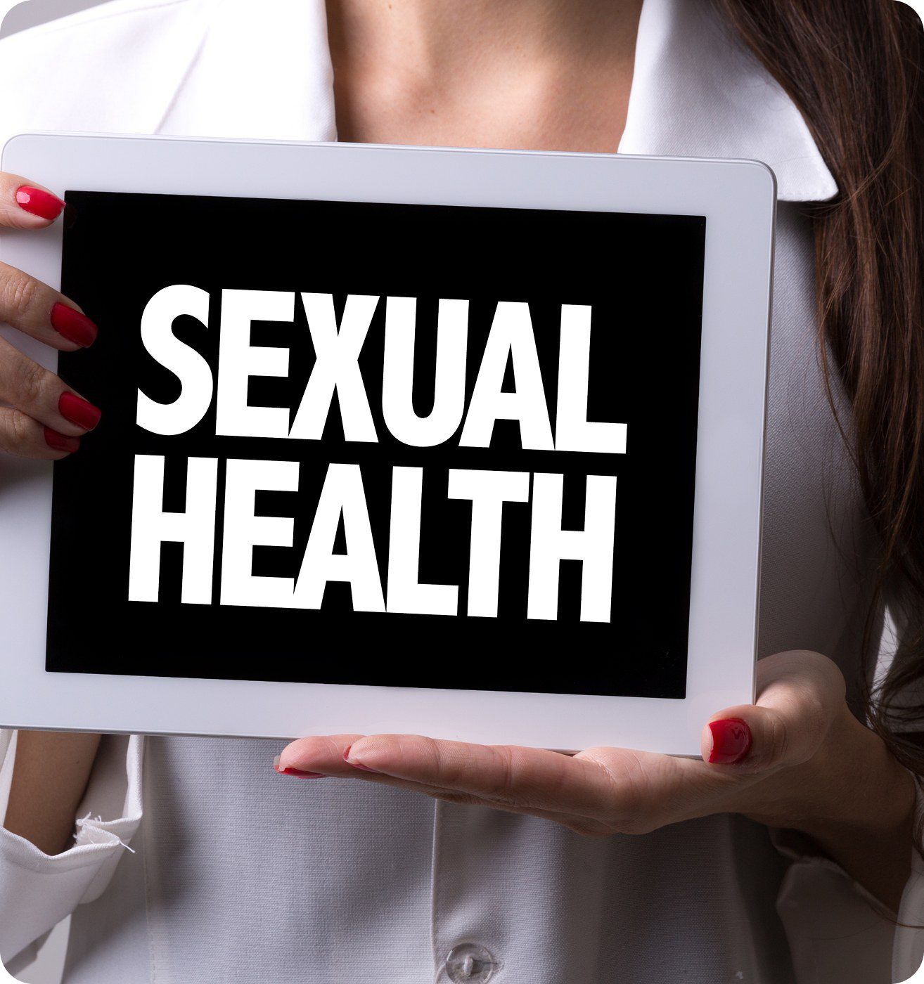 Tablet displaying "Sexual Health" in bold letters.