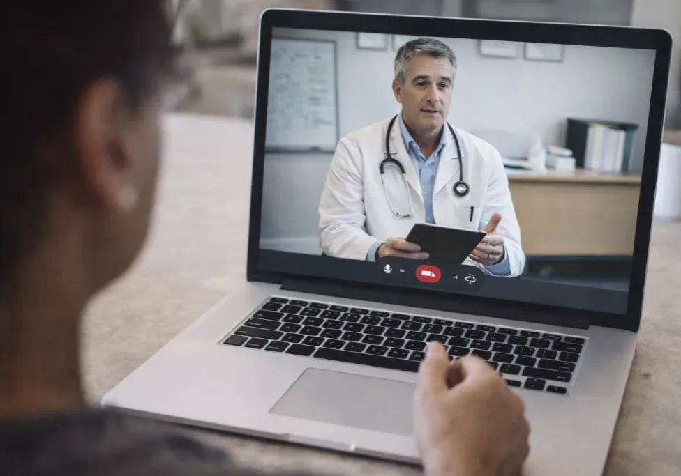 San Diego physician explaining medication-assisted treatment for opioid use disorder in a clinical setting.